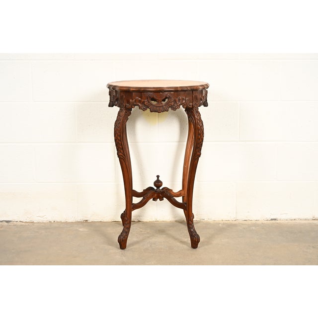 A gorgeous French Provincial Louis XV style side table In the manner of Romweber USA, Circa 1930s Beautiful carved walnut,...