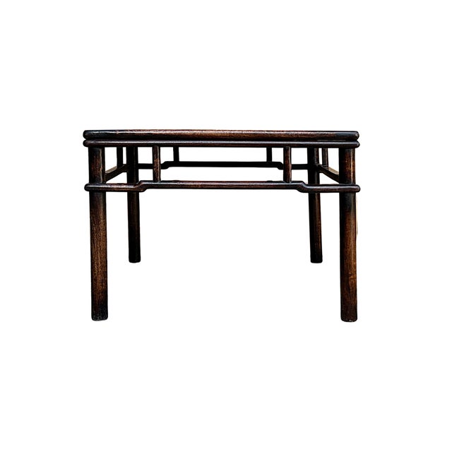 This vintage Ming-style coffee table showcases a refined, square silhouette characterized by the elegant simplicity of...