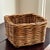 A charming petite vintage handwoven storage basket featuring a warm honey-colored patina developed over time. Crafted from...