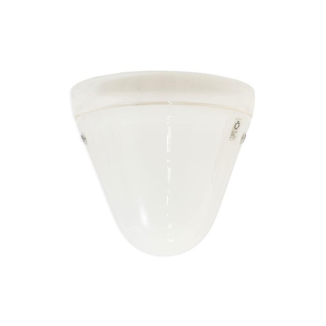 This pair of Leucos Italian wall sconces dates to the 1960s and features softly diffused milky white glass shades with a...