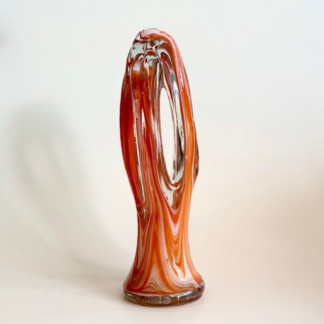 A beautiful example of mid-century American art glass, this hand-blown Arklahoma sculpture showcases a vivid orange and...