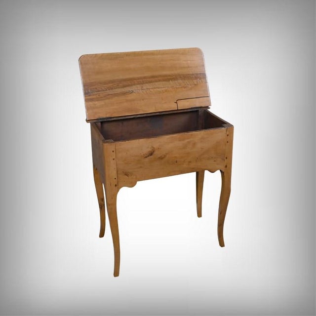 This charming Louis XV period kneading table, crafted from walnut and pear wood, captivates with the harmony of its soft...