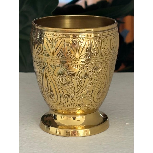 Bright solid brass etched cup. No maker's mark. Most items found at Pub & Oasis are vintage and antique in nature which we...