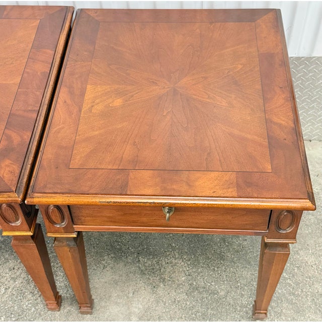 Charming pair of Louis XVI style end tables by Hekman furniture. Solid cherry construction, tapered legs, single...