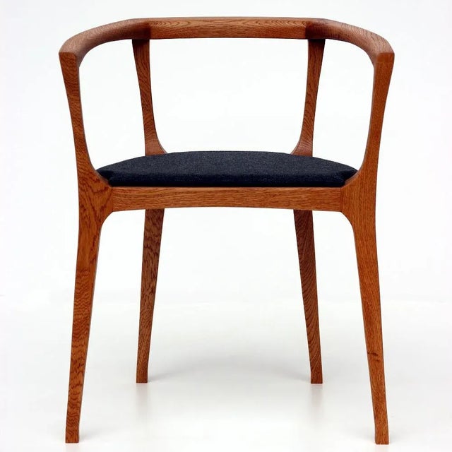 The design has its origin in the work itself. The starting point is the contour of the chair legs. The prerequisite is a...