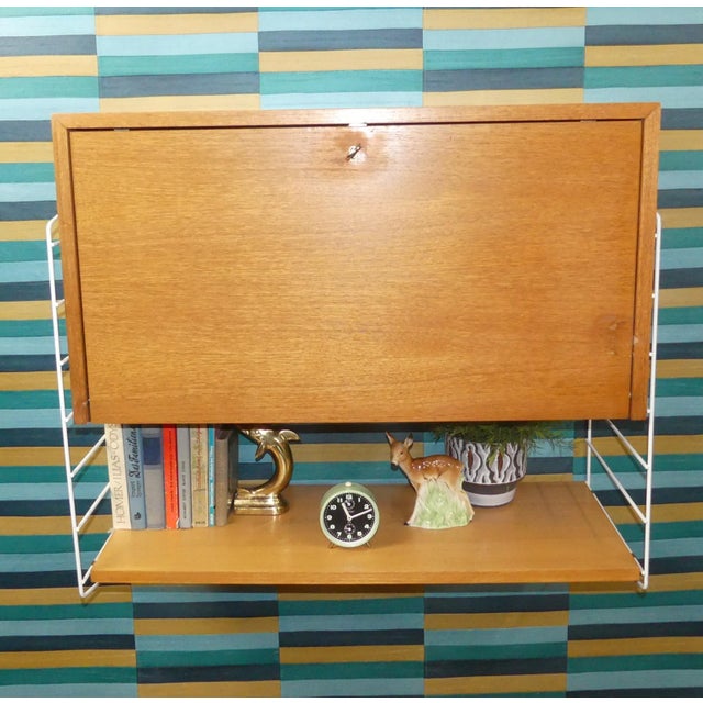 An absolute classic! simple, swedish design design classic nisse strinning designed his famous shelving system in 1949. It...