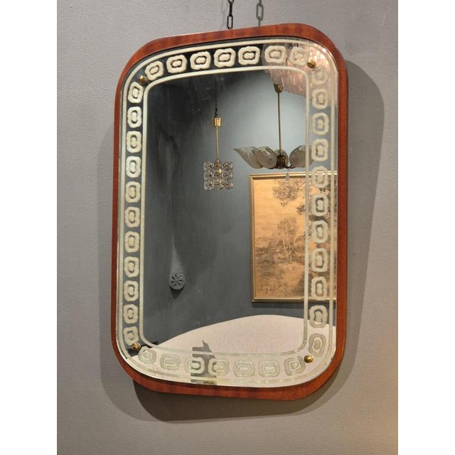 Swedish Modern mirror with sandblasted decor and teak wood frame, mid1900s. Soft, beautiful shape with decorative pattern....