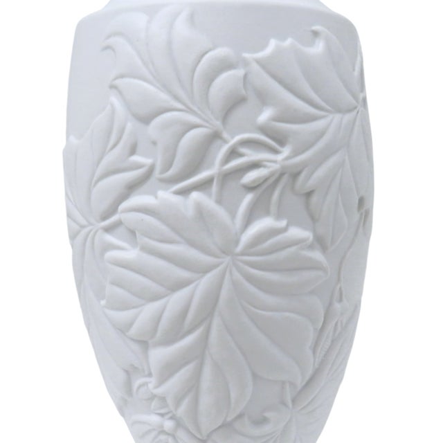 Vintage Bavarian white bisque porcelain vase by Royal Porzellan KPM. The vase has an embossed stylized maple leaf...