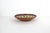 This is a vintage red clay ceramic pottery plate or bowl, hand-painted, showcasing traditional folk art. This is signed by...