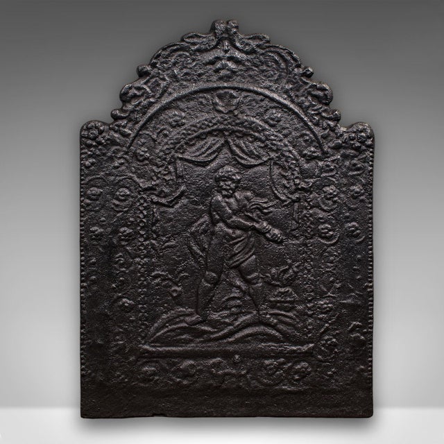 This is an antique decorative fire back. An English, cast iron fireplace backrest in Neoclassical taste, dating to the...