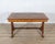 An elegant 19th-century Lombardy table, finely veneered in walnut and various precious woods, exemplifying the artistry...