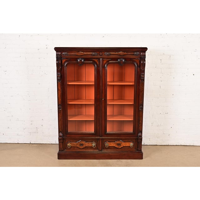 A gorgeous antique Eastlake Victorian or Renaissance Revival bookcase cabinet or display cabinet In the manner of Herter...