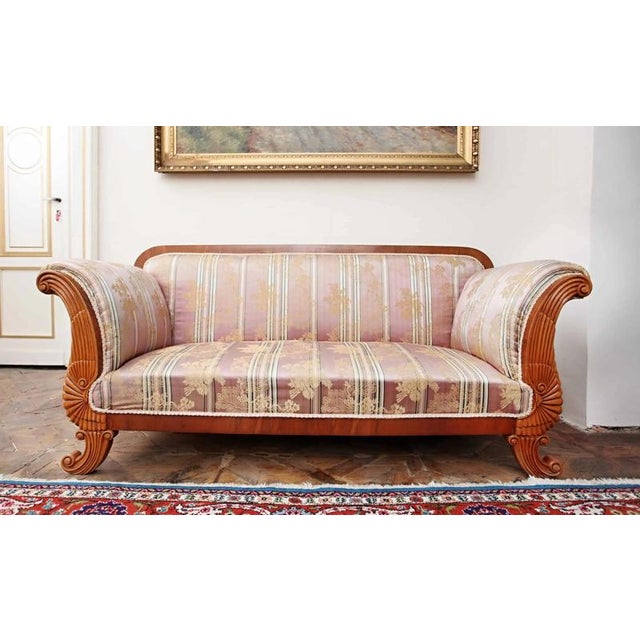 Solid construction refined with veneer and carving. Comfortable seating on springs with African grass. (The upholstery was...