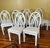 Universal Furniture White Dining Chairs Arched Open Work Geometric Rounded Back Set of Six This exceptionally stylish set...