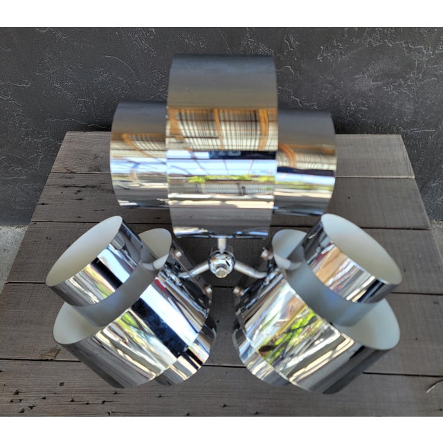 A Mid-Century Modern polished chrome 3 light chandelier / pendant light. Circa. 1970's. Attributed top Robert Sonneman...