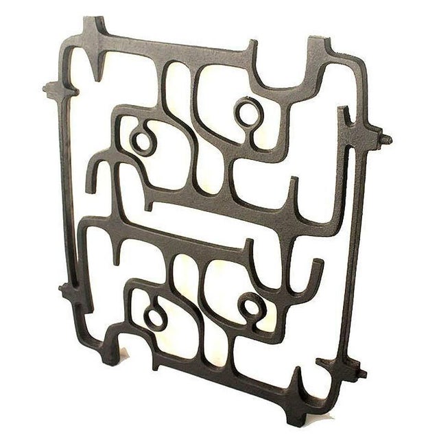 Extraordinary 1950s mid-century cast iron wall sculpture with an interlaced design in the style of the sculptors of the...