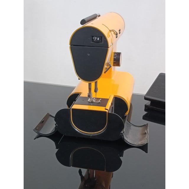 Magnificent omnia special zz type m12 sewing machine by manufrance. saint etienne, france, 1970s. yellow lacquered metal...