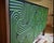 The loop sideboard three door with black doors and a carved pattern hand painted in gold. this piece will add a...