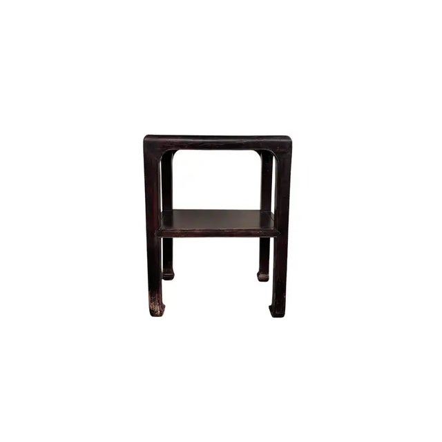This elegant lacquered table was crafted in Northern China at the middle of the 20th century. It features elegant legs...
