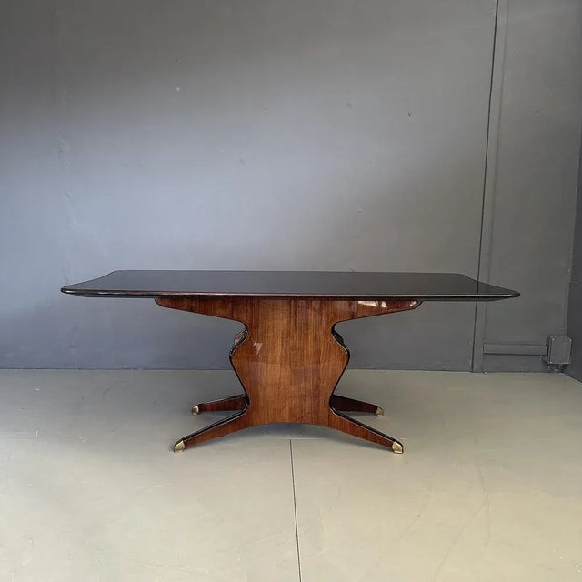 Dining table designed by Osvaldo Borsani, produced by Fossati Attilio & Arturo in the 1950s, Italian manufacture. Its...