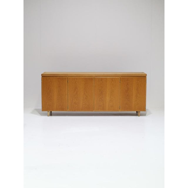 Large sideboard produced by Skovby Møbelfabrik in Denmark, 1960s. This oak sideboard features four doors with beautiful...