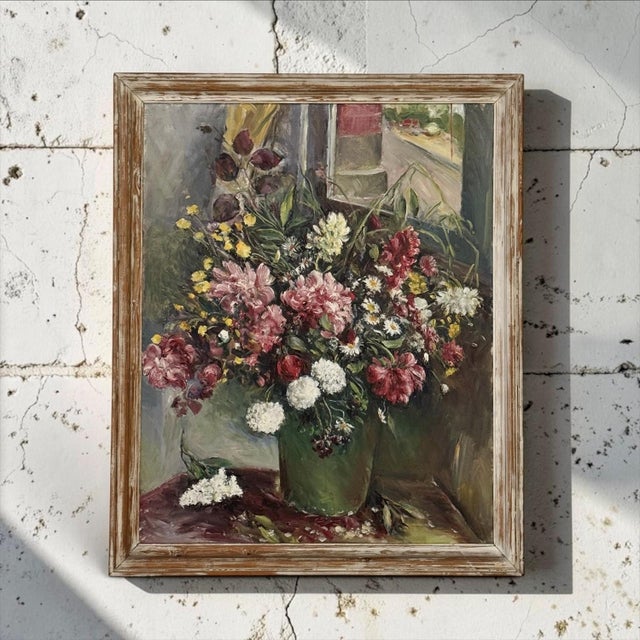 This antique floral still life by Henri Dufaux (1879–1980) presents a generous garden bouquet arranged in a simple green...