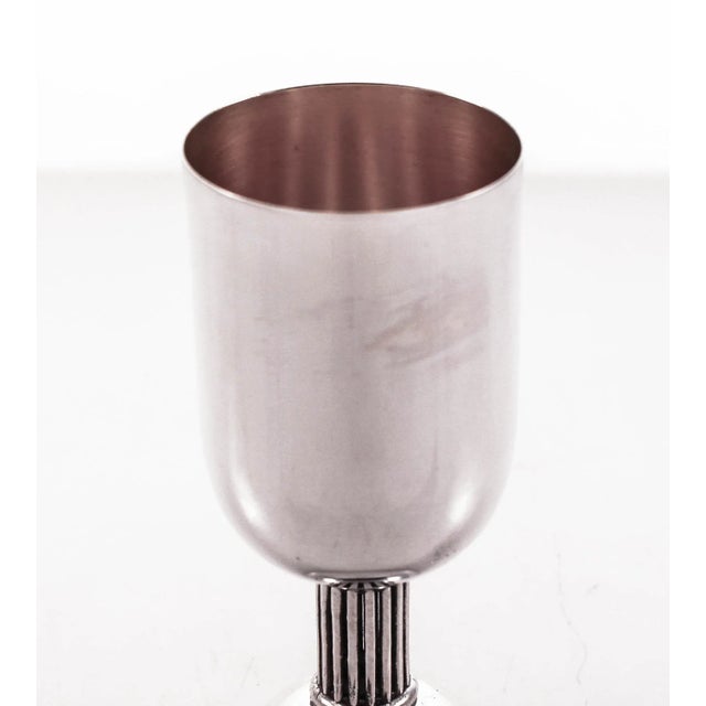 We are delighted to offer this sterling silver wine cup (Kiddush). It has a modern look and the stem is a colonnade. With...