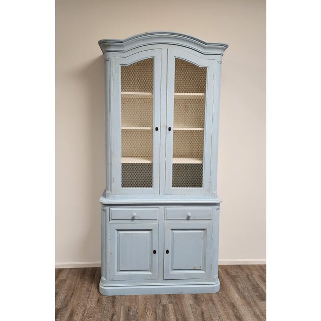 Swedish Rococo style solid pine two-part vitrine/display cabinet with bonnet top, chicken wire doors, two drawers and...