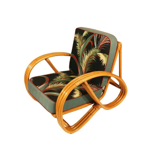 Post War three strand, 3/4 pretzel arm rattan set of two side chairs features a rare decorative wave detail around the...