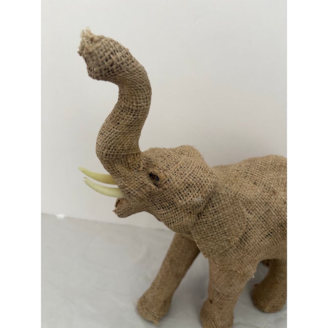 This charming vintage elephant sculpture is a beautifully handcrafted example of mid-century global folk art. Sculpted in...