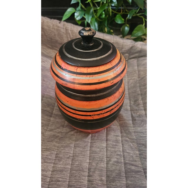 Discover a striking mid-century South Asian folk art piece with this authentic 1960s Pakistani wooden lacquerware jar....