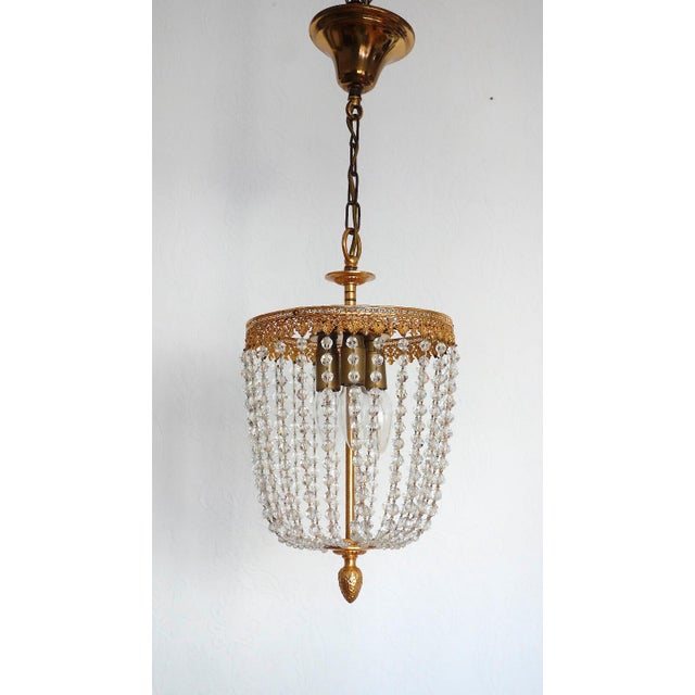 Brass Lead Crystal Pearl Three Lights Chandelier, 1960s, in Very Good conditions. Designed 1960 to 1969 I have official...
