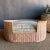 A cozy retreat for furry friends, it showcases a handwoven rattan frame with a dipped front for easy access. The plush...