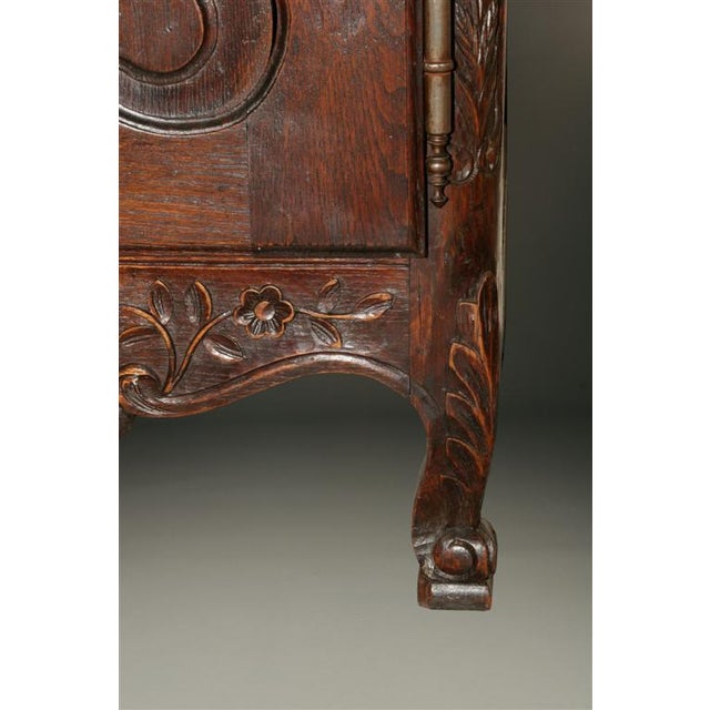 Exceptional 19th-century French Neo-Rustique Louis XV style vaisselier, hand carved in oak and designed with an impressive...