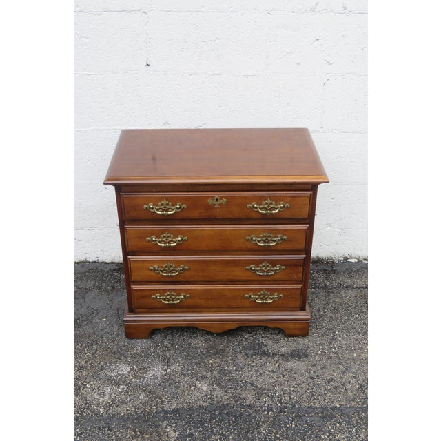 This classic Large Nightstand is made of wood, solid wood, veneer, and metal. The Side Table was made by Kaufman of...