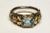 An unusual combination ring of 18K gold (weighted, not plated) over an oxidized sterling silver. It features an emerald...
