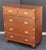 A handsome British military officer’s Campaign Ware chest of drawers or dresser, from the 19th century, featuring a...