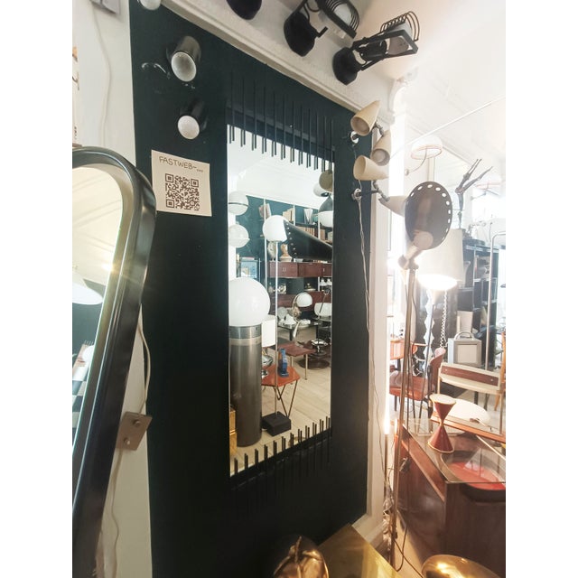 A very rare and beautiful wall mirror by Ettore Sottsass, produced by Santambrogio & De Berti. The vertical mirror is...