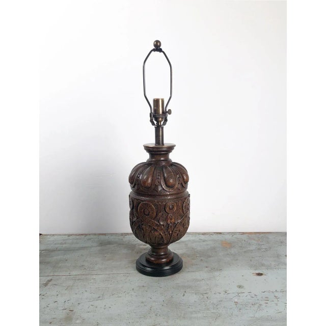 A pair of 19th-century English oak balustrades later mounted as lamps.