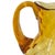 A striking mid-century masterpiece, this Fenton Diamond Optic amber glass pitcher epitomizes 1960s American glass design....