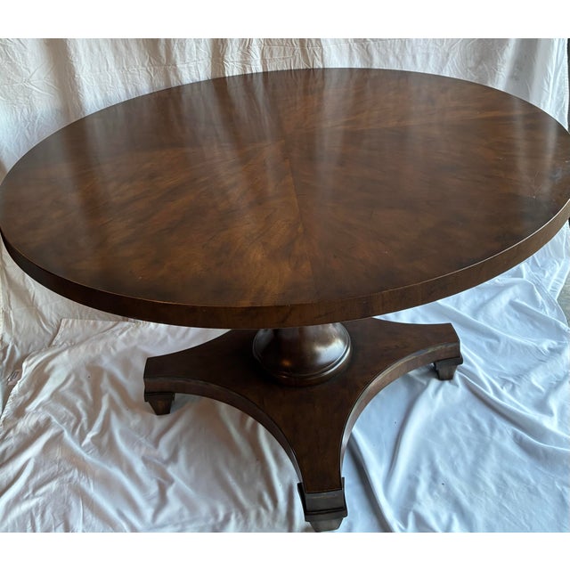 This is an authentic Baker Furniture Collector’s Edition round pedestal dining table, crafted in the United States and...