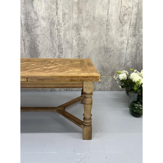 Dimensions: 179.5cm wide (folded) 308.5cm (extended) Table width is 99cm and height is 76cm. The distance between the legs...