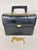 Elevate your professional or daily wardrobe with this striking vintage Chic de Paris structured portfolio bag. Masterfully...