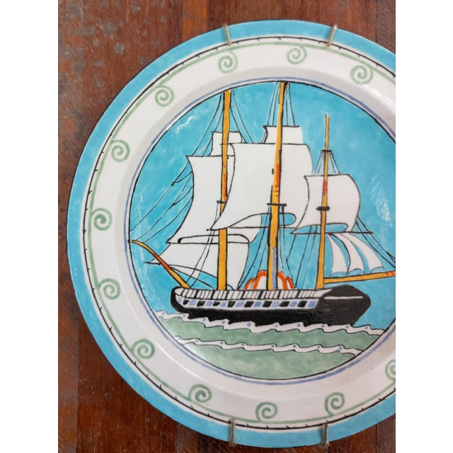 We are selling this charming and colorful English Wedgwood plate. This plate is hand decorated with a sailing ship on...