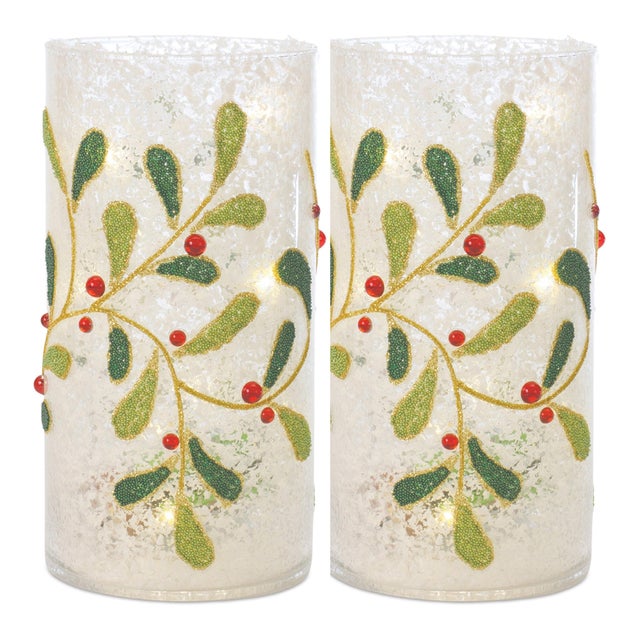 Create a warm and festive ambiance this holiday season with the Beaded Glass Mistletoe Candle Holder Set. Designed to...