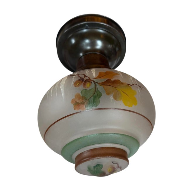 Such a charming light fixture. This would look great in your next mountain or lake house. Handpainted acorns and oak...
