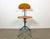 This industrial height adjustable, rotating chair was made in former Czechoslovakia during the 1950s.It features a dark...
