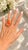 A dramatic Italian statement ring from the 1970s, centered on an impressive hand-carved red coral depicting a classical...