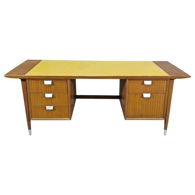 Modern style executive desk with yellow formica top, metal handles and cane back.