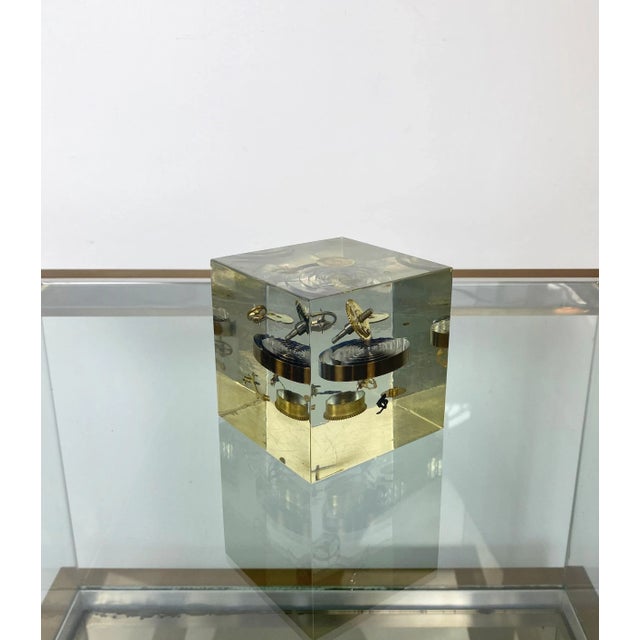Cube sculpture with clock parts immersed in acrylic by Pierre Giraudon. Made in France, circa 1970. This piece is...